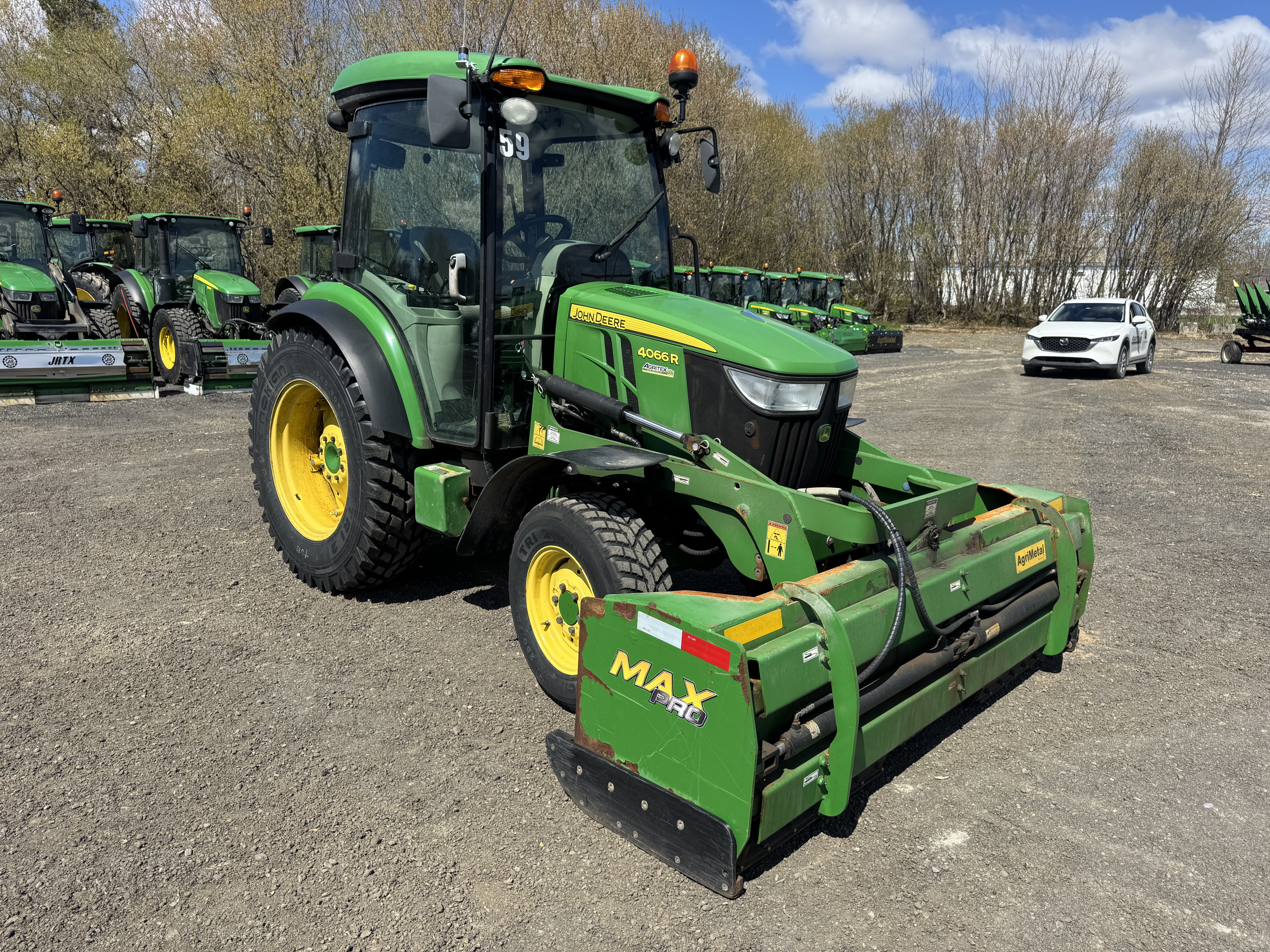 John Deere 4066R GRATTE NOKIAN    