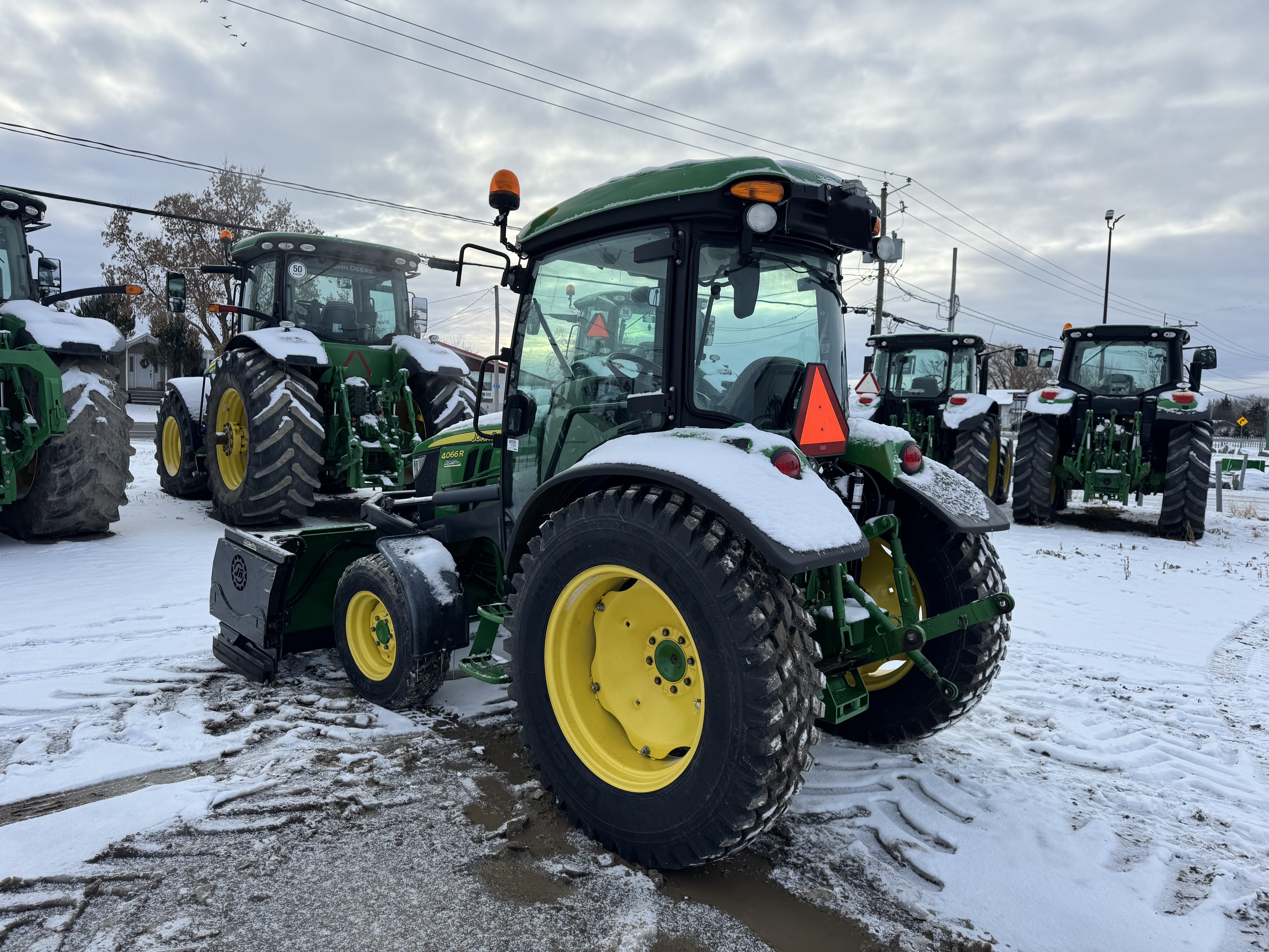 John Deere 4066R GRATTE NOKIAN    