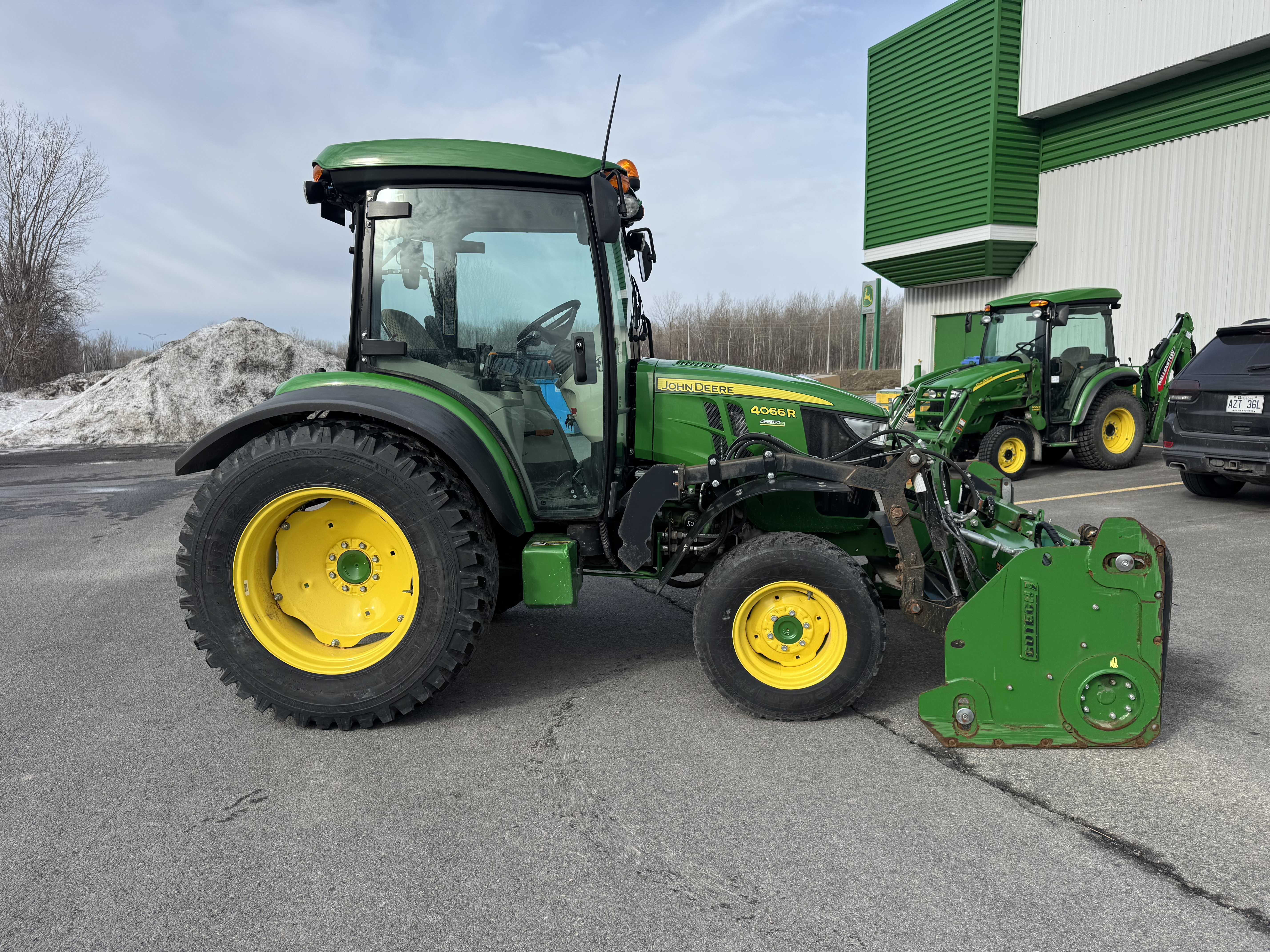 John Deere 4066R GRATTE NOKIAN    